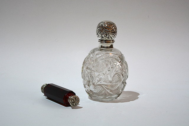 Appraisal: A Victorian ruby glass double ended scent bottlewith embossed white