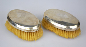 Appraisal: A pair of gent's oval silver-backed hairbrushes Mappin Webb London