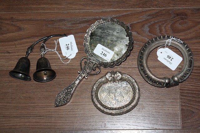 Appraisal: AN ORIENTAL SILVER COLOURED METAL HAND MIRROR two amulets and