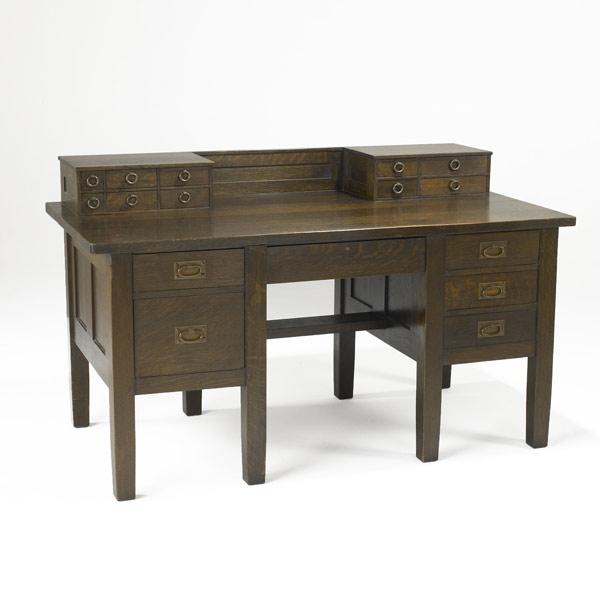 Appraisal: GUSTAV STICKLEYRare and early six-drawer desk with gallery and paneled