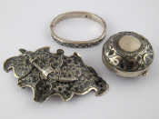 Appraisal: Russian niello silver A belt buckle retained by a chained