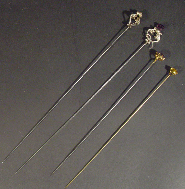 Appraisal: Four silver and gold metal mounted hat pins two of