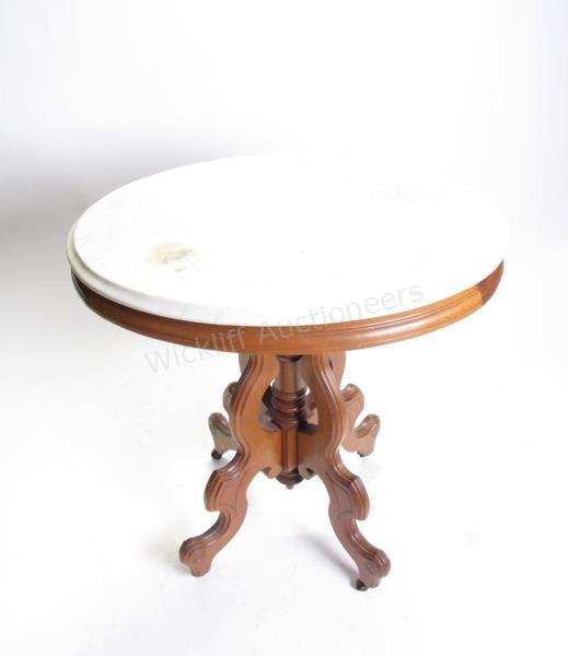 Appraisal: A walnut Victorian side table oval white marble top crack