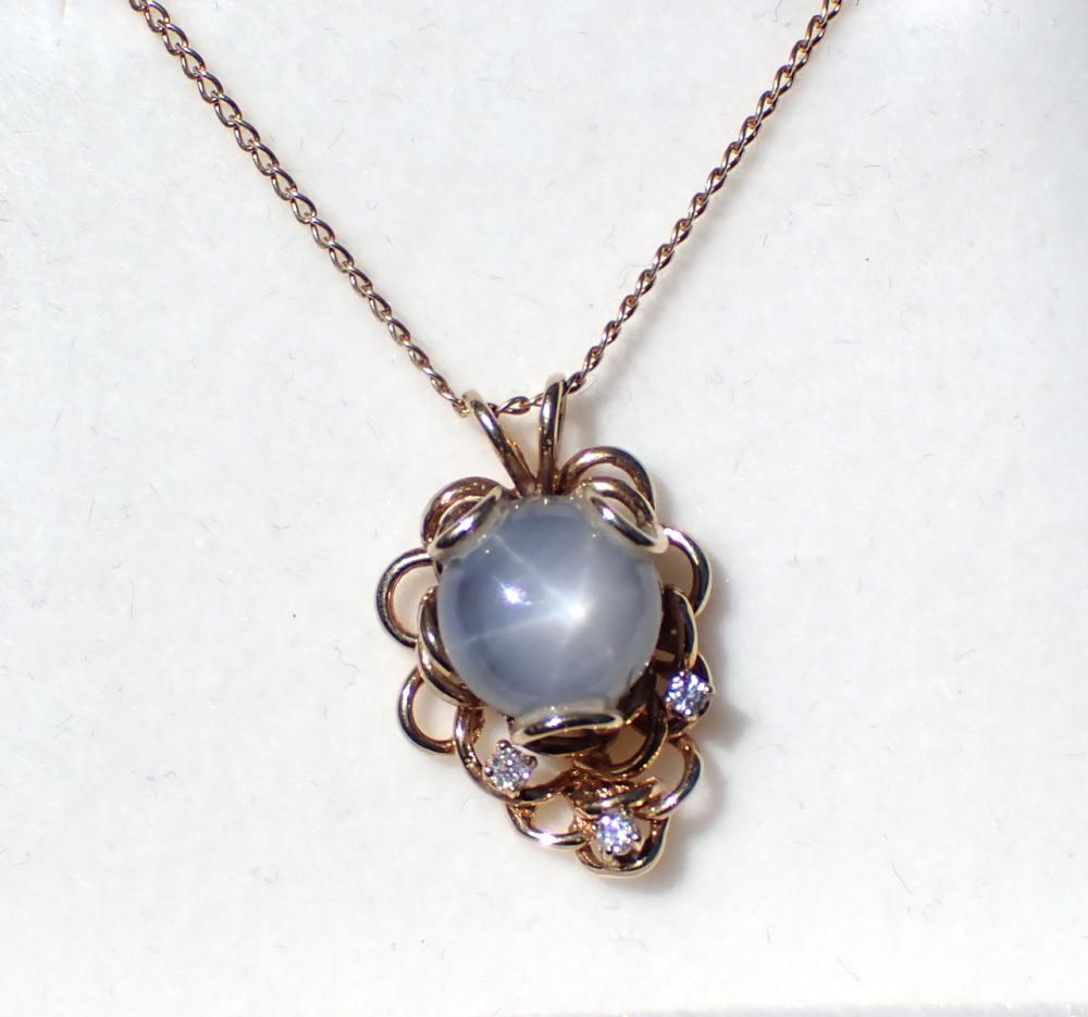 Appraisal: STAR SAPPHIRE DIAMOND AND FOURTEEN KARAT GOLD NECKLACE with a