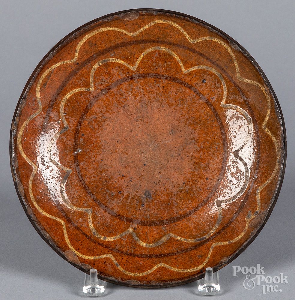 Appraisal: Pennsylvania redware plate early th c Pennsylvania redware plate early