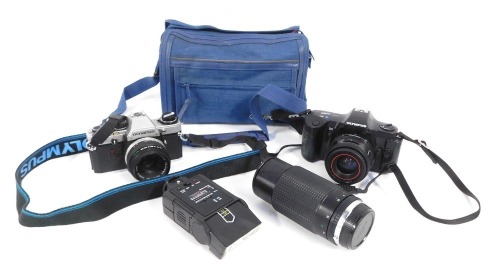 Appraisal: An Olympus OM camera and lens OM and lens etc