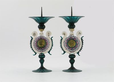 Appraisal: A pair of Venetian coloured glass pricket candlesticks with central