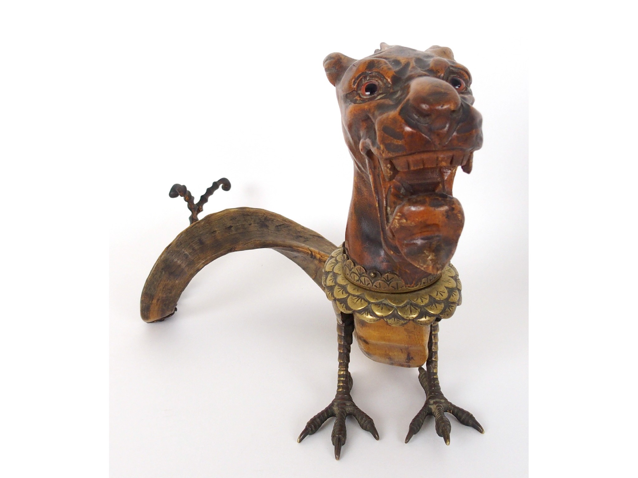 Appraisal: A German carved wood horn and bronze mounted figural table