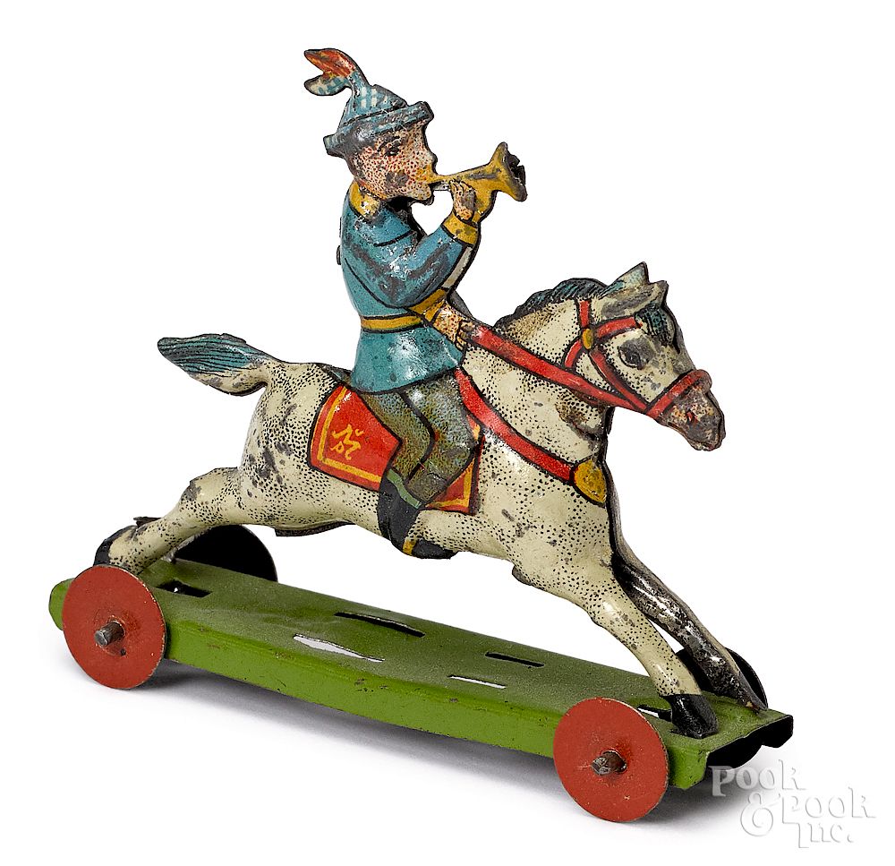 Appraisal: Meier boy on horse with trumpet penny toy Meier tin