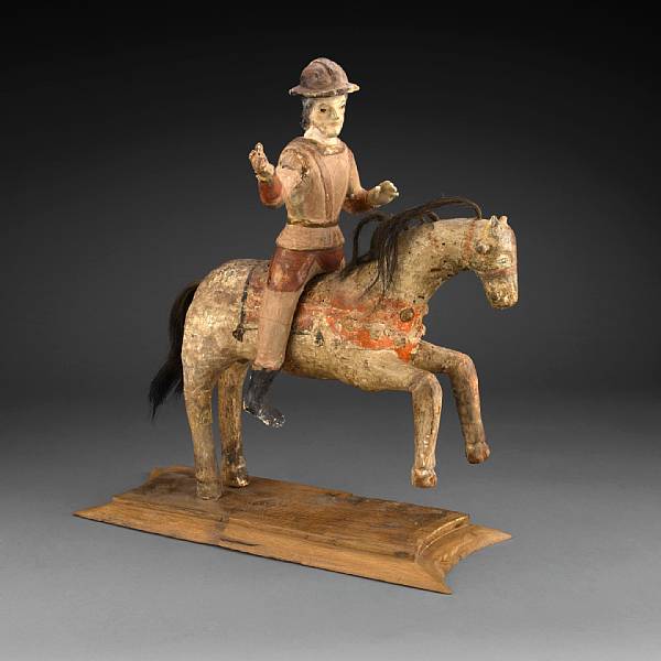 Appraisal: A Portuguese polychrome decorated figural group of a horse and