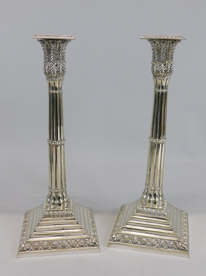 Appraisal: A pair of thC silver plated candlesticks each cast with