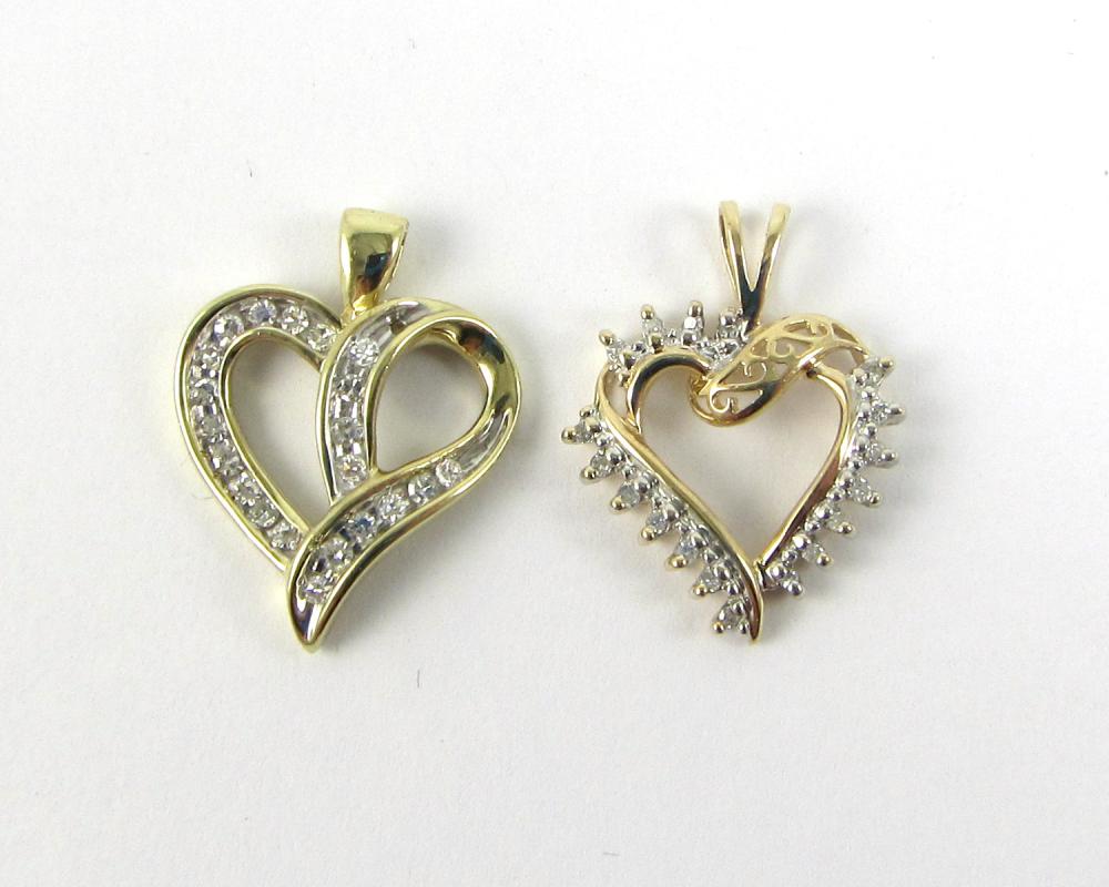 Appraisal: TWO DIAMOND AND YELLOW GOLD HEART PENDANTS k yellow gold