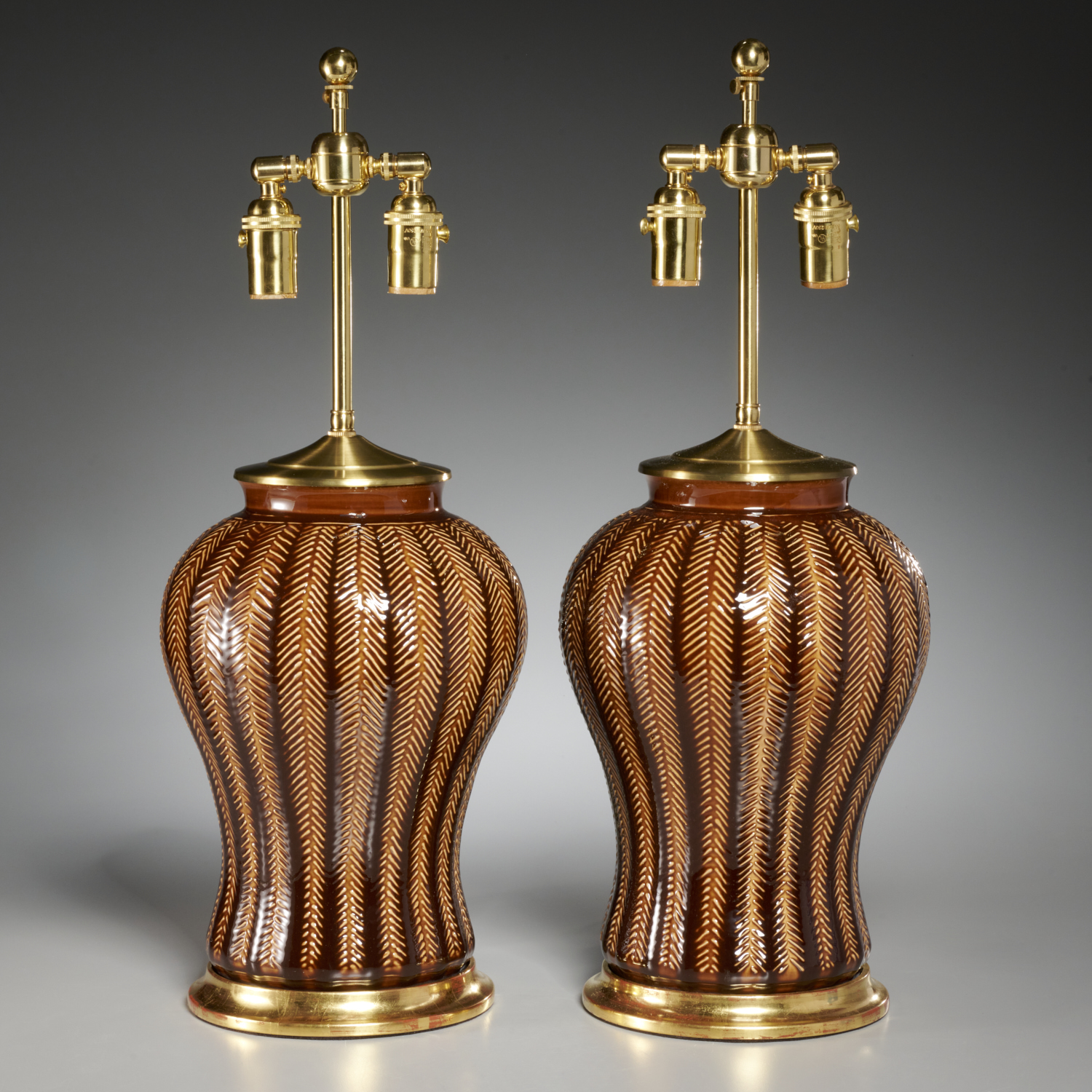 Appraisal: CHRISTOPHER SPITZMILLER PAIR DOUGLAS LAMPS th c USA brown glazed