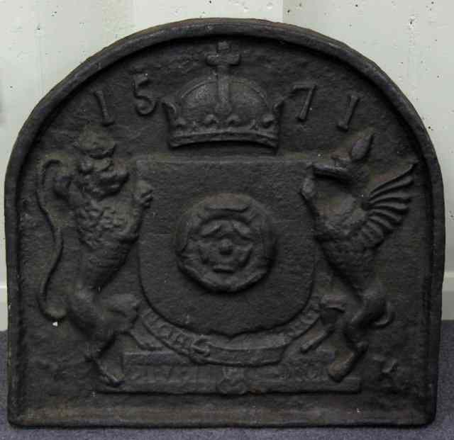 Appraisal: A cast iron fire back embossed a central Tudor rose