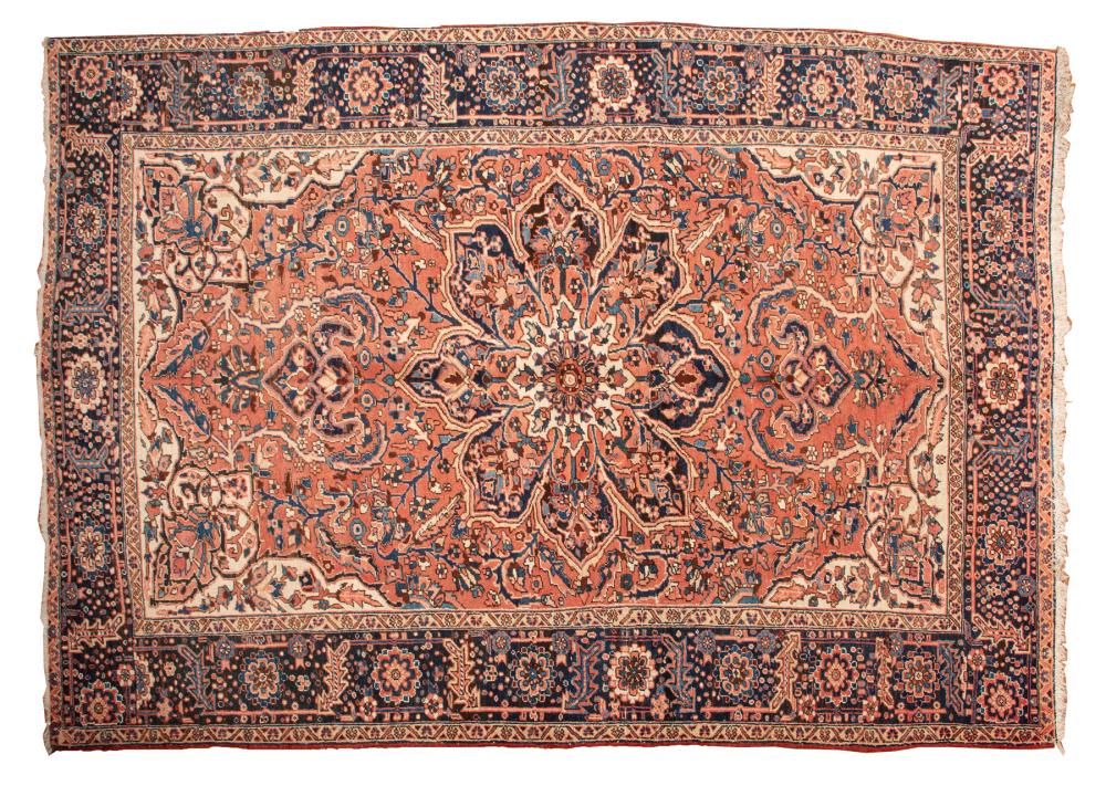 Appraisal: PERSIAN HERIZ CARPETPersian Heriz Carpet pink ground blue border central