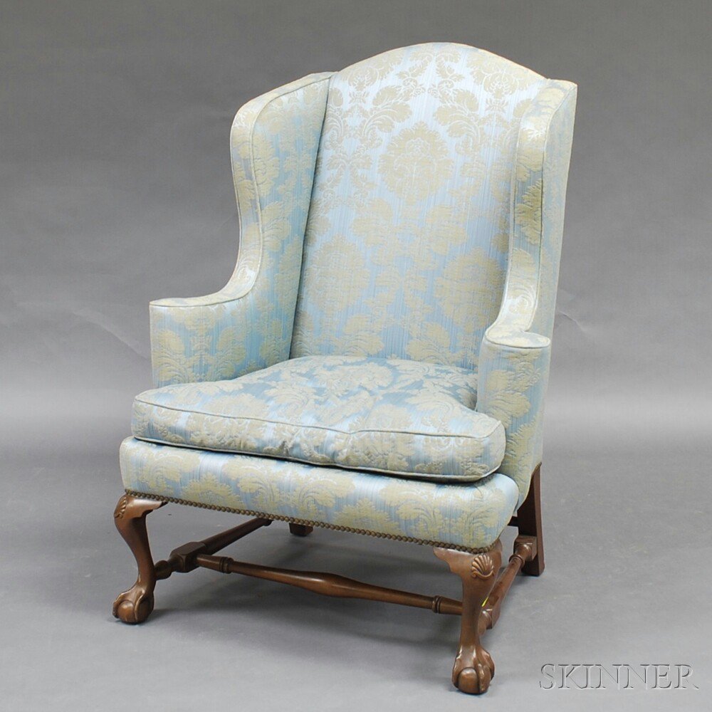 Appraisal: Chippendale-style Carved Mahogany Wing Chair the arched cresting and shaped