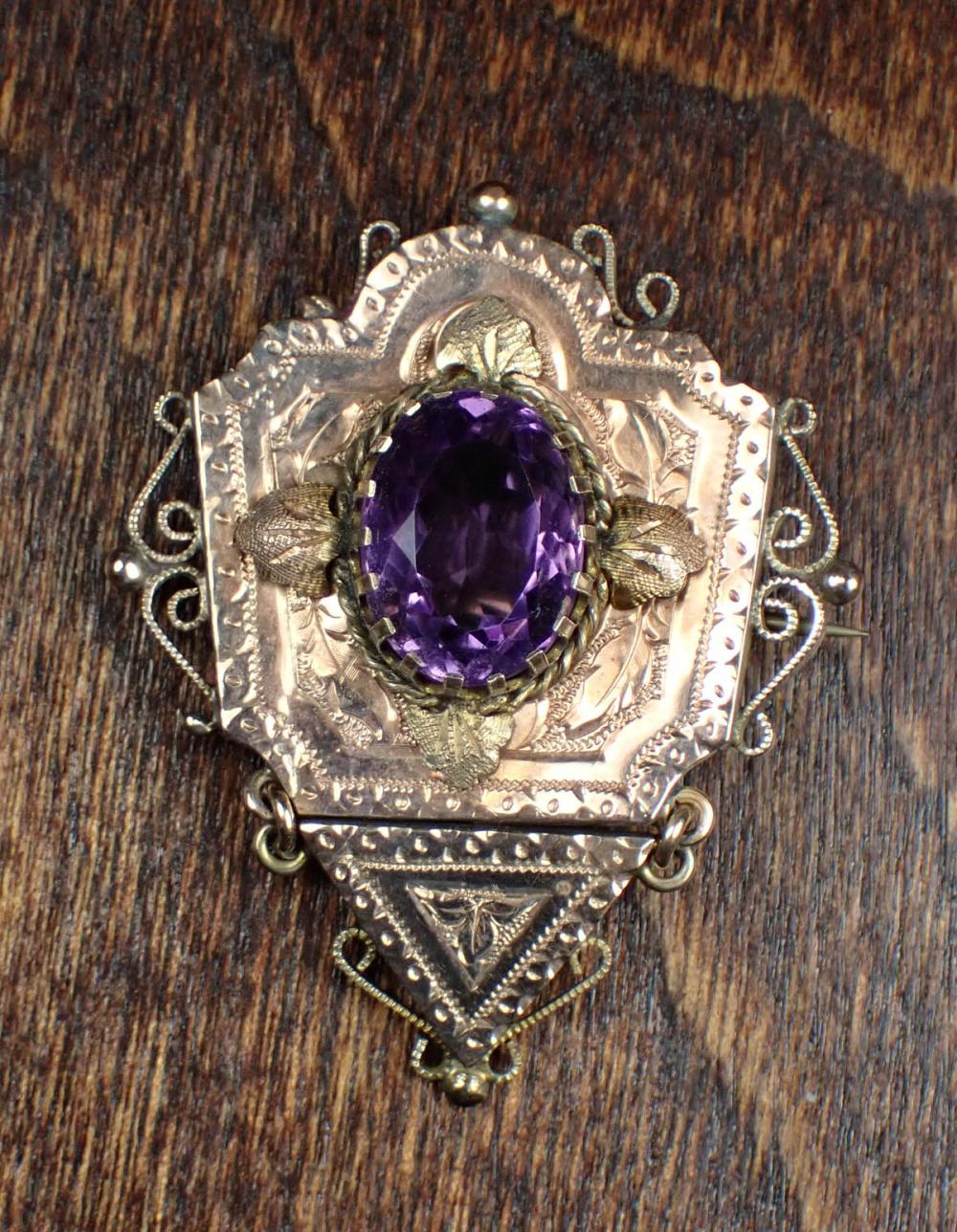 Appraisal: VICTORIAN AMETHYST AND TWELVE KARAT GOLD PENDANT BROOCH The rose