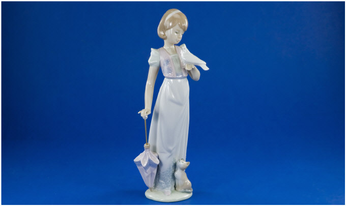 Appraisal: Lladro Figure Summer Stroll No Girl with folded umbrella holding