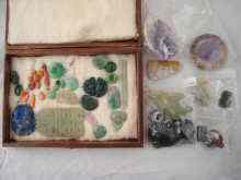 Appraisal: A display box containing about items of hardstone and coral