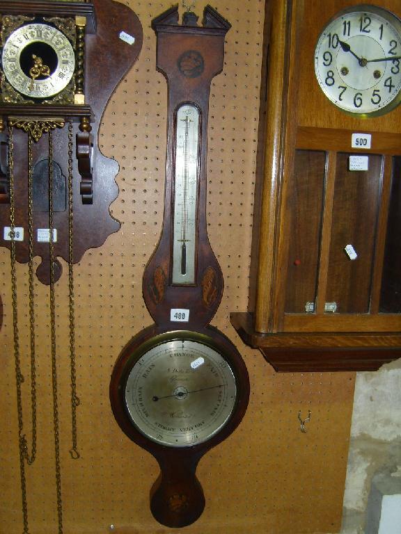 Appraisal: A Georgian mahogany wheel barometer with shell inlaid detail silvered