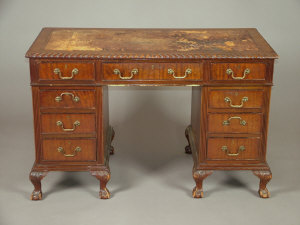 Appraisal: A Reproduction mahogany pedestal desk the leather inset top with