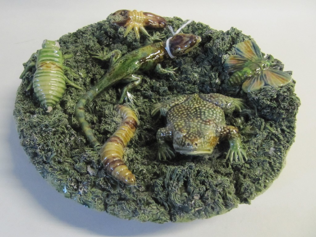 Appraisal: Portuguese Palissy style plate decorated with a toad lizard and