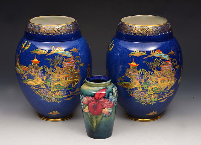 Appraisal: A PAIR OF CARLTONWARE BLUE LUSTRE VASES with oriental landscape