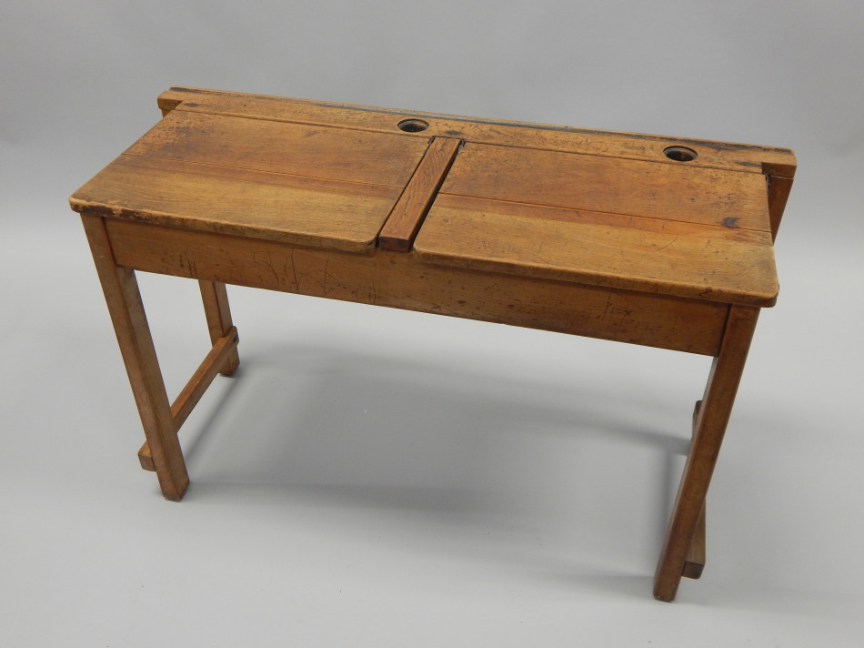 Appraisal: A child's double school desk with inkwell recess etc cm