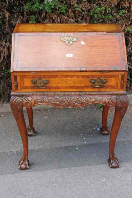 Appraisal: A TH CENTURY WALNUT BUREAU the fall front enclosing fitted