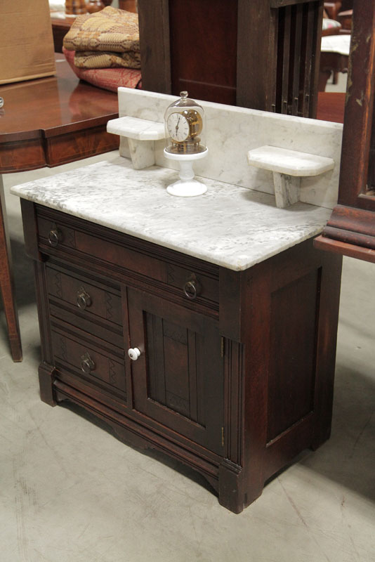 Appraisal: VICTORIAN COMMODE White marble top with gallery on a walnut