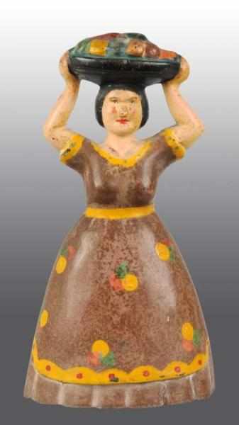 Appraisal: Cast Iron Tropical Woman with Fruit Doorstop Description Numbered Condition