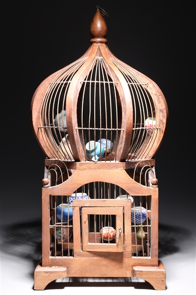 Appraisal: Antique bird cage sculpture with stuffed bird and numerous small