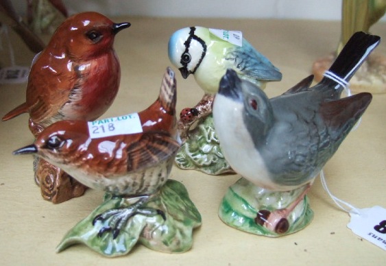 Appraisal: Four Beswick bird figures Blue tit No Wren No Robin