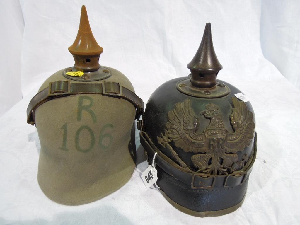 Appraisal: A Prussian First World War Pickelhaube with brass helmet badge