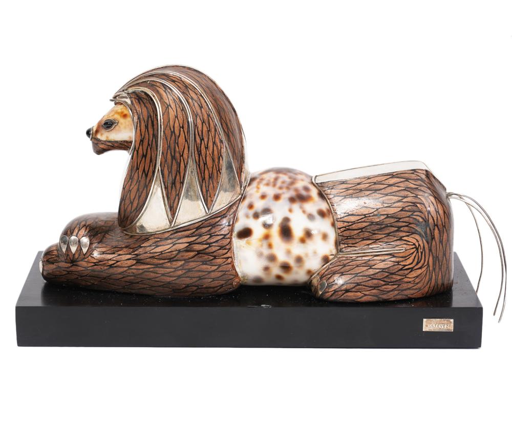 Appraisal: ROBERTO ESTEVEZ LION SCULPTURELion or Griffin sculpture with Cowry shell