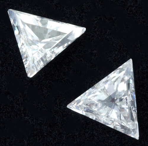 Appraisal: Pair of unmounted diamonds triangle shape straight-side faceted Approx cts