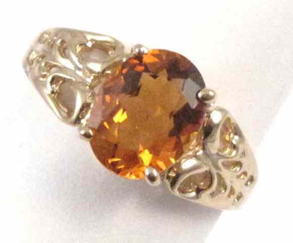 Appraisal: CITRINE AND TEN KARAT GOLD SOLITAIRE RING set with an