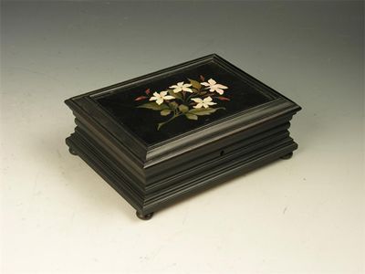 Appraisal: A th century ebonised rectangular box the hinged cover inset