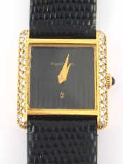 Appraisal: An ct gold and diamond lady's wristwatch with cabochon button