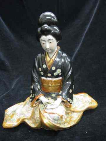 Appraisal: Japanese Satsuma Porcelain Figurine ofseated lady holding a pocketwatch wearing