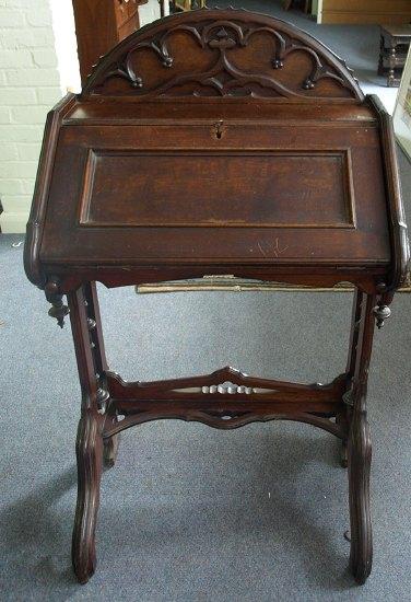 Appraisal: A late th Century Gothic style writing table the arch