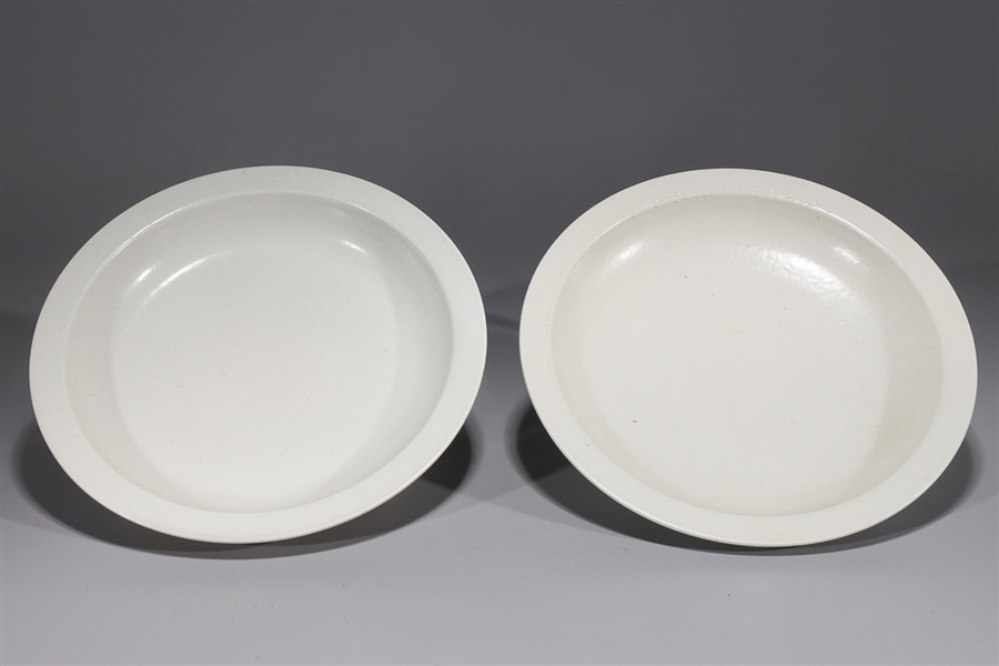 Appraisal: Pair of Chinese Kangxi style white glazed porcelain dishes each