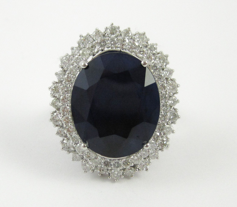 Appraisal: FOURTEEN KARAT WHITE GOLD SAPPHIRE AND DIAMOND RING the approximately