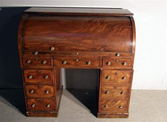 Appraisal: th century mahogany cylinder front pedestal desk the interior with