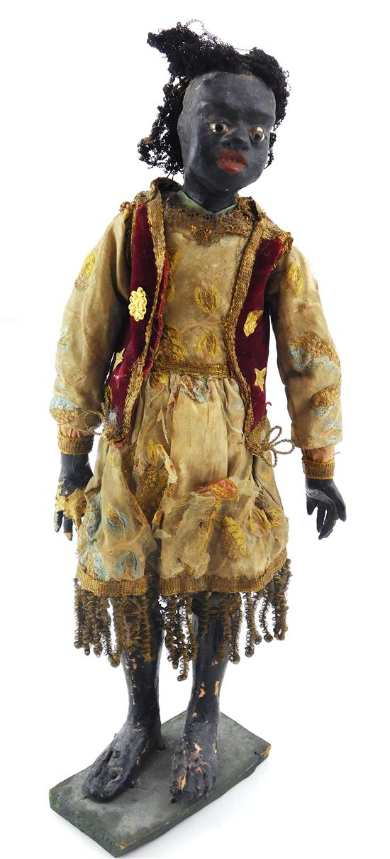 Appraisal: th C Blackamoor or Moorish cr che doll on stand