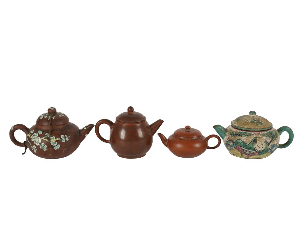 Appraisal: FOUR CHINESE YIXING CLAY TEAPOTSthree marked to underside Provenance Property