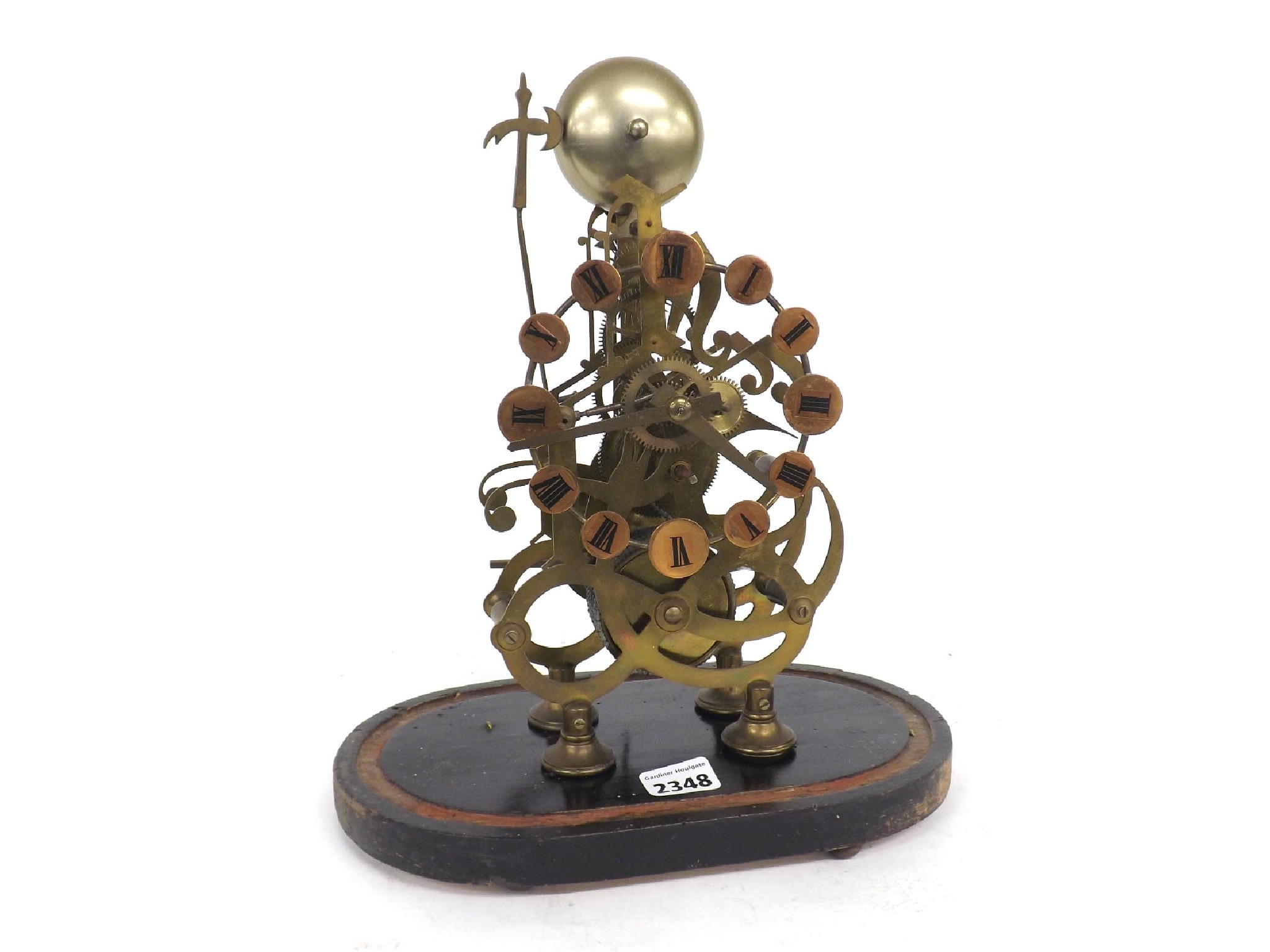 Appraisal: Brass single fusee skeleton clock with passing strike upon a