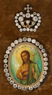 Appraisal: A RUSSIAN ANTIQUE MEDALLION ICON OF SAINT JOHN THE BAPTIST