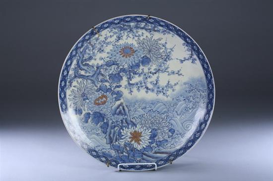 Appraisal: JAPANESE BLUE AND WHITE PORCELAIN CHARGER With chrysanthemum prunus flowering