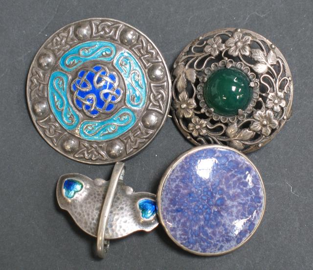 Appraisal: THREE ARTS AND CRAFTS STYLE BROOCHES including a pewter and